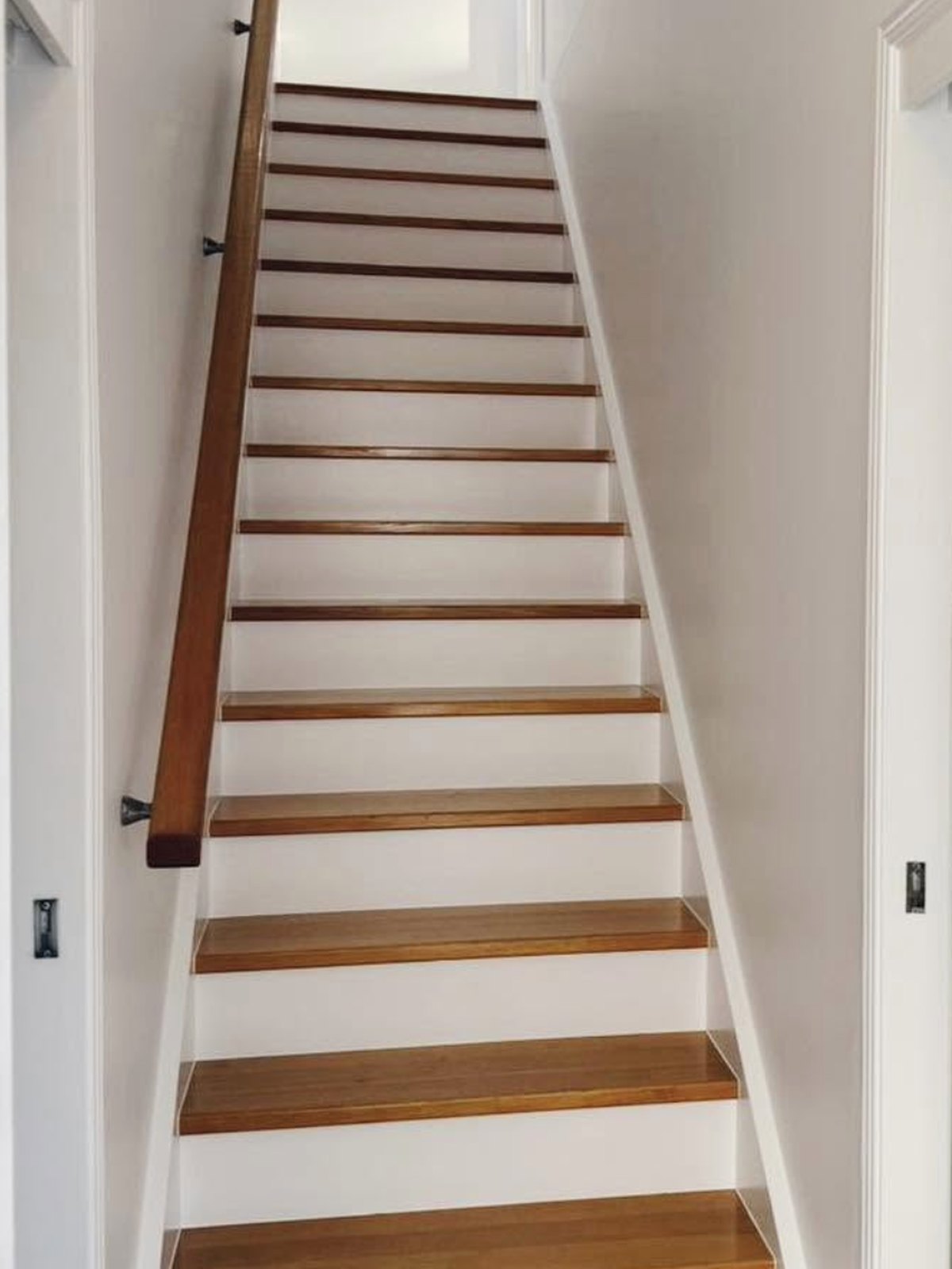 Finished white staircase with natural timber treads