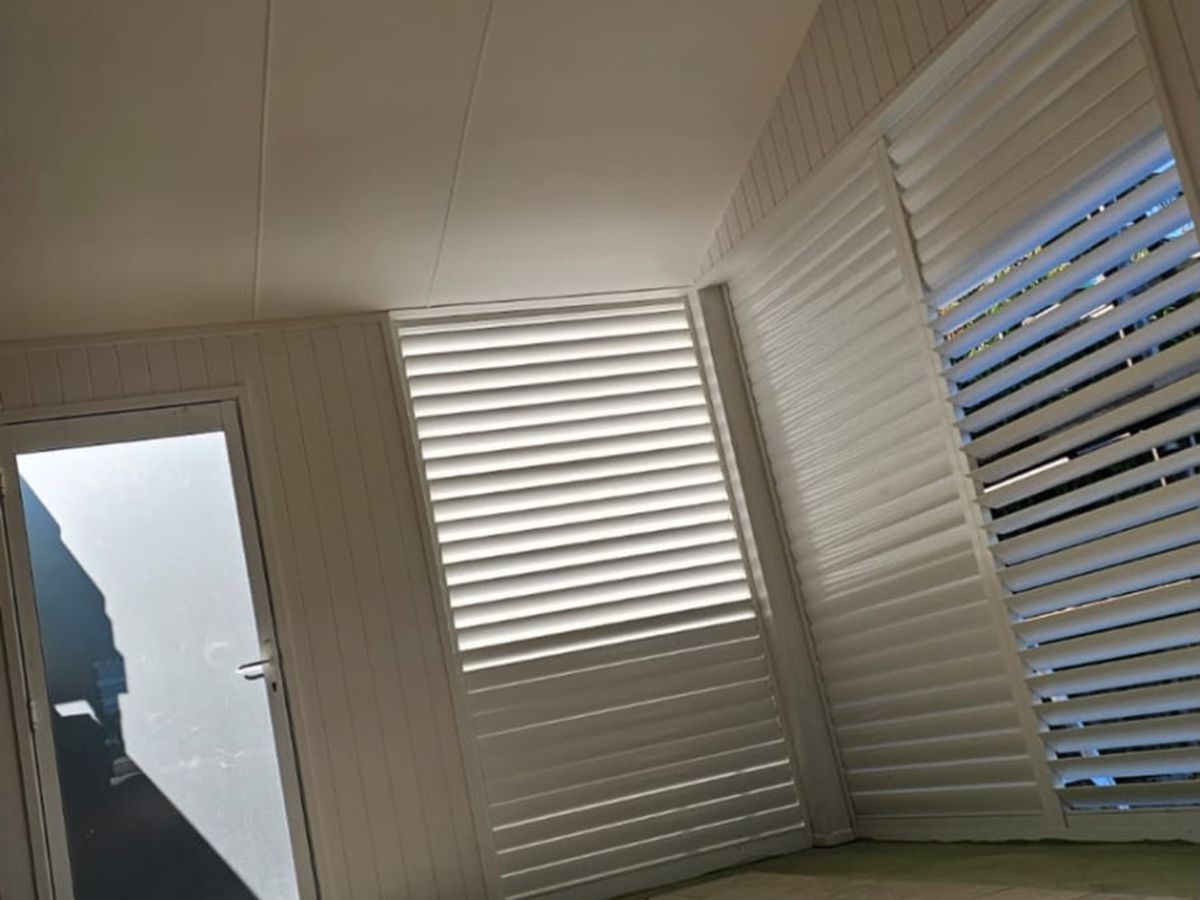 Freshly painted patio ceiling and cladding after restoration