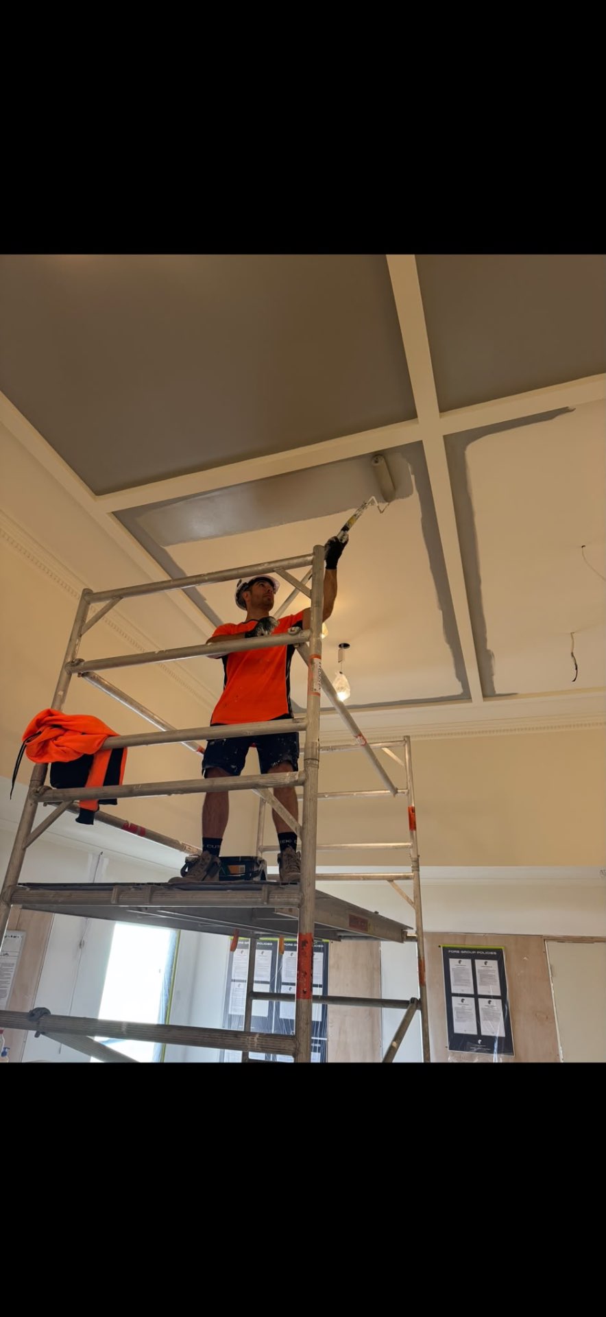 YTS PaintPro tradesman on scaffold preparing a coffered ceiling