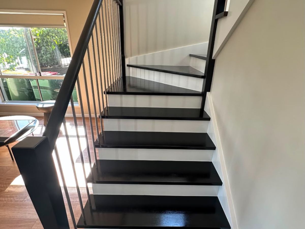 Staircase refinished in satin black with white risers
